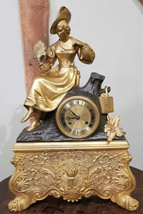 French gilt bronze & patinated bronze Mantle Clock